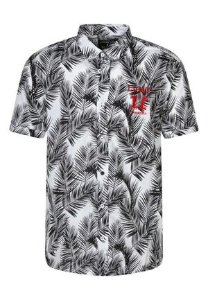 Chemise à manches courtes avec un motif de feuilles de palmier noires sur fond blanc, dotée d'un logo rouge brodé sur la poitrine gauche. Front à boutons.