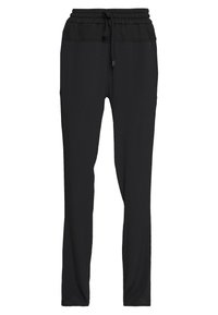 Svarta träningsbyxor i mjukt tyg, med en elastisk midja som har dragsnöre, smal passform och utan synliga mönster eller detaljer.