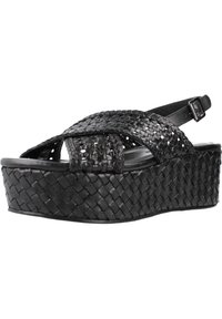 Sandali platform intrecciati neri con design a treccia, dotati di una fascia slingback e una suola testurizzata e rialzata per maggiore altezza.