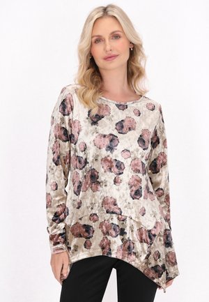 Langærmet top i velourstof med blomstermønster i nuancer af pink og sort, der har en rund kant og løs pasform.