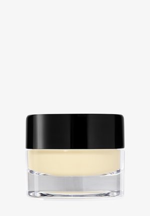 Barattolo di vetro trasparente con un coperchio nero. Contiene un prodotto cremoso di colore giallo pallido. Texture liscia, forma rotonda e design minimalista.