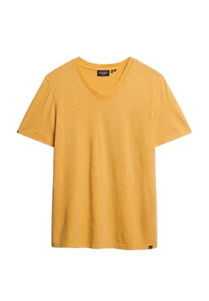 Geel v-hals t-shirt gemaakt van zachte, gestructureerde stof. Korte mouwen en een losse pasvorm. Heeft een klein merklabel aan de onderkant.