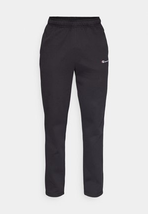 Fekete melegítőnadrág rugalmas derékkal, bal felső részen egy kis logóval. Puha anyagból készült, szűkülő lábszár kialakítással.