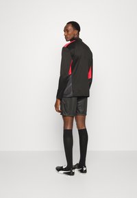 Puma INDIVIDUALCUP TRAINING  - Langarmshirt - puma black sunblaze