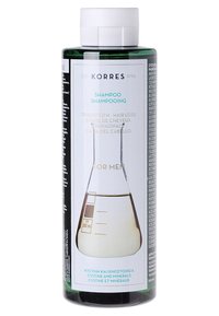 Bottiglia cilindrica verde di shampoo Korres contro la perdita dei capelli, 250 ml, con un'etichetta bianca e turchese che presenta un grafico di un beaker e testo multilingue.