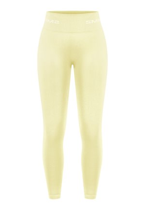 Žluté legíny z měkkého materiálu s bezešvým designem a širokým pasem s bílým nápisem "SMIM".