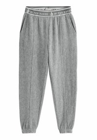Pantalons gris à côtes avec une taille élastique étiquetée "b by Ted Baker." Comprend des poches latérales et des poignets ajustés aux chevilles.