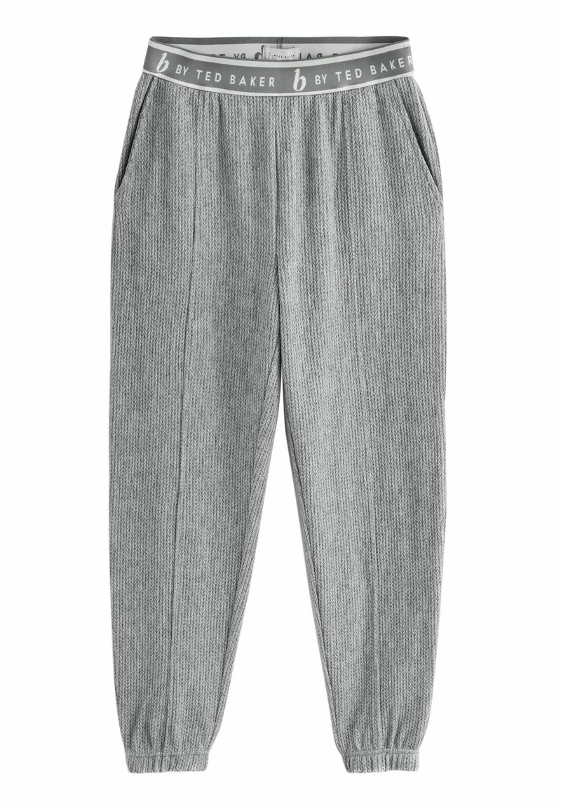 Pantalons gris à côtes avec une taille élastique étiquetée "b by Ted Baker." Comprend des poches latérales et des poignets ajustés aux chevilles.