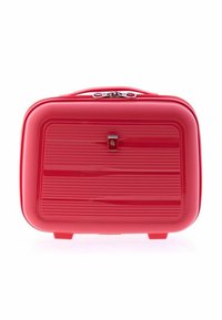 Red hard-shell cosmetic case with horizontal ridges, silver zipper, and top carry handle on a white background.