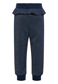 Mörkblå byxor med en texturerad tyg och en volangmidja. Åtsittande mudd vid anklarna. Diskret vävt mönster över hela.