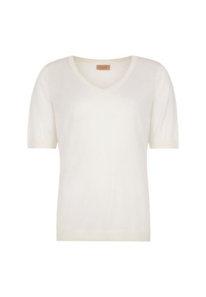 Kortærmet, hvid V-hals sweater med tætsiddende kant og mærkat inde i kraven, vist på en ens hvid baggrund.