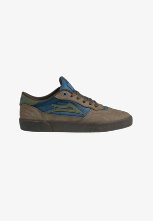 Low-top sneaker in brown and blue with green accents, lace-up design, textured rubber sole, and cushioned collar and tongue.