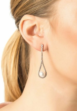 Drop earrings featuring a teardrop shape with a central pearl surrounded by a silver-toned frame adorned with small clear gemstones.