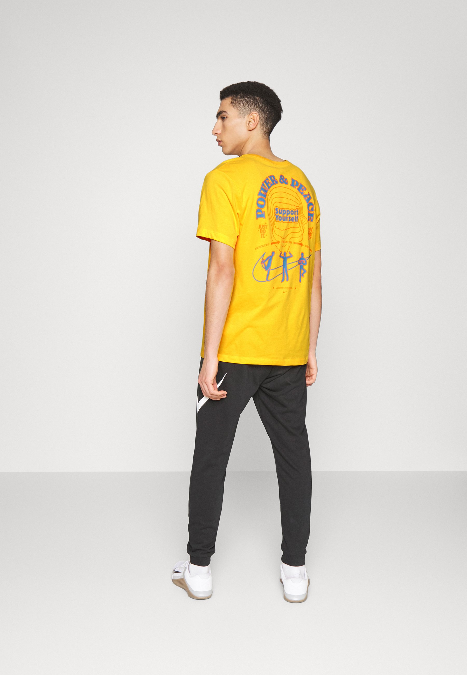 nike university gold shirt
