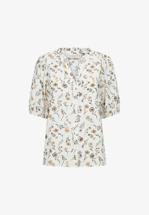 Witte blouse met korte pofmouwen, knoopsluiting aan de voorkant en een patroon van beige en bruine wilde bloemen en groene bladeren.