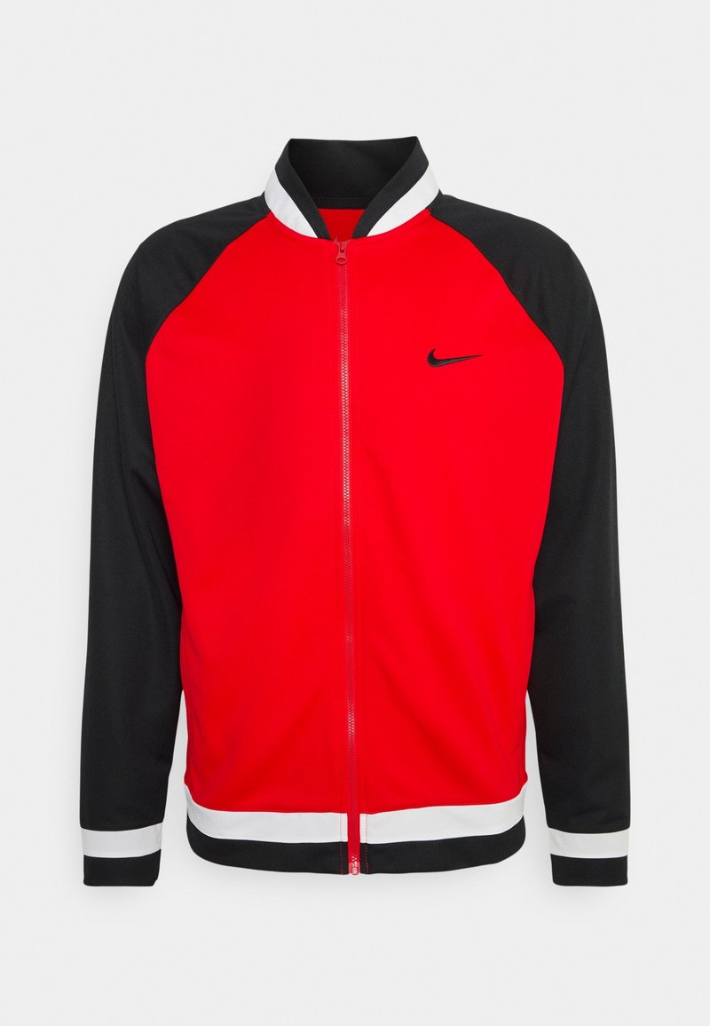Veste zippée rouge et noire avec un col et des poignets blancs. Présente un logo Nike sur la poitrine et des manches de couleur contrastée. Tissu lisse.