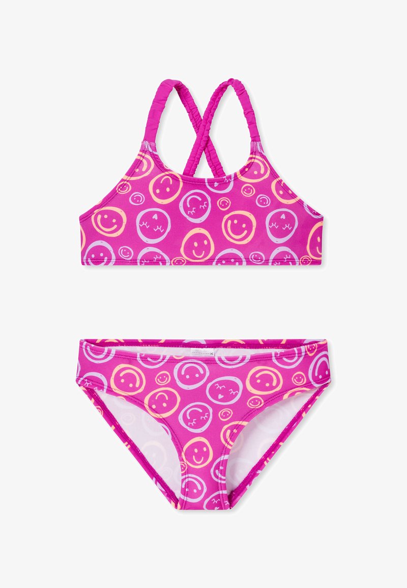 Roze bikini set met een top met kruisbanden en bijpassende broekjes, voorzien van een speels patroon van smiley gezichten en cirkelvormige ontwerpen in verschillende kleuren.