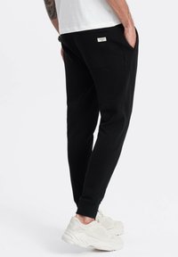 Ombre Jogginghose - black