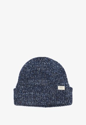 Gebreide muts in marineblauw met lichtblauwe en witte spikkels. Heeft een omgeslagen rand en een klein label aan de zijkant met de merknaam.