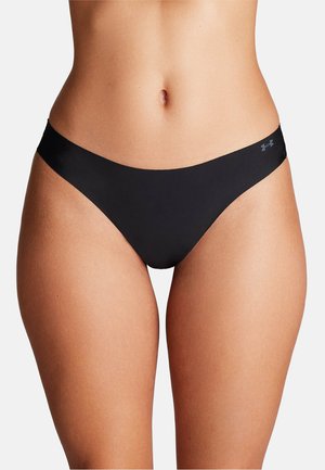 Perizoma nero con una texture liscia e copertura minima, caratterizzato da un logo discreto sulla vita.
