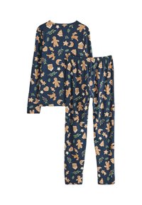 Ensemble de pyjama bleu marine comprenant un haut à manches longues et un pantalon à taille élastique. Le motif inclut des bonhommes en pain d'épices, des arbres et des étoiles en beige et vert.
