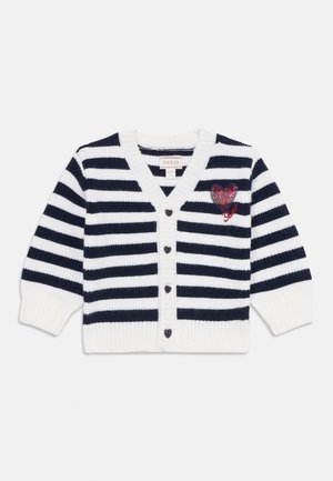 Child's knitted cardigan with navy and white horizontal stripes, heart-shaped buttons, and a red sequined heart patch on the chest.