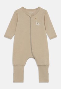 Bēšs bērnu kombinezons no mīksta kokvilnas, ar priekšējo rāvējslēdzēju, garām piedurknēm un uz krūtīm redzamu ziloņa attēlu ar balonu.