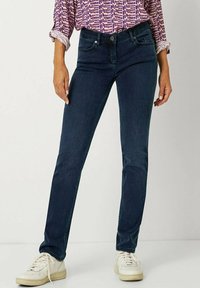 Dunkelblaue, eng anliegende Jeans aus Denim, mit einem klassischen Fünf-Taschen-Design, dezenten Nähten und einer mittelhohen Taille.