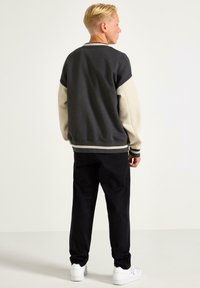 Lindex WILMER WIDE LEG - Chinos - black