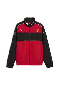 Giacca rossa e nera con colletto alto, zip frontale, dettagli bianchi e logo Ferrari sul petto. Realizzata in tessuto morbido e leggero.