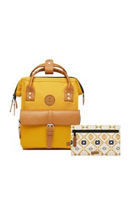 Yellow canvas backpack with brown leather accents, a fold-over flap, and a decorative patterned pouch featuring geometric designs.
