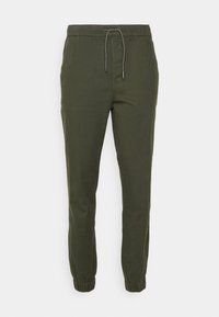 Zelené joggingové kalhoty vyrobené z lehkého materiálu, s elastickým pasem na šňůrku a elastickými manžetami na kotnících.