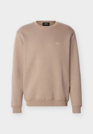 Felpa beige con scollo a girocollo, maniche lunghe, polsini e orlo a coste, e piccolo logo bianco "Mads Nørgaard Copenhagen" sul petto sinistro.