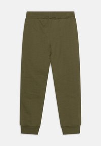 Ελαιόχρωμο παντελόνι φόρμας φτιαγμένο από μαλακό βαμβακερό ύφασμα, με ελαστική μέση και στενές μανσέτες στους αστραγάλους.