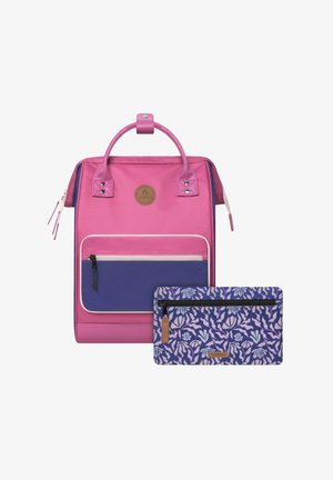 Pink backpack with a purple front pocket, featuring a logo, metal accents, and a detachable patterned pouch with a floral design.