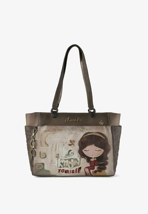 Sac fourre-tout en cuir marron bicolore, avec une illustration d'une fille et le texte "Connais-toi toi-même" sur le devant. Texture lisse et anses robustes.