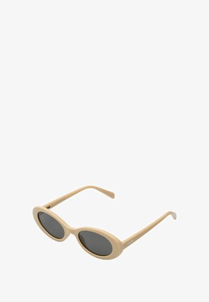Lunettes de soleil ovales beige avec des verres gris foncé. Fini lisse et mat avec des branches fines. Nom de la marque imprimé sur le côté.