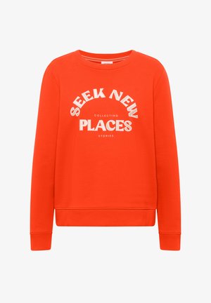 Heldere oranje lange mouw sweatshirts met witte tekst op de voorkant: "Seek New Places Collecting Stories", met een ronde halslijn, geribbelde manchetten en zoom.