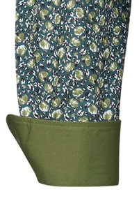 Tessuto a motivo floreale in verde acqua con accenti verdi e bianchi. Il polsino è di un verde uniforme; texture liscia con dettaglio dell'orlo arrotolato.