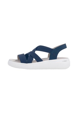 Sandale bleu marine à bout ouvert avec des brides élastiques croisées et une semelle blanche matelassée conçue pour le confort et le soutien.