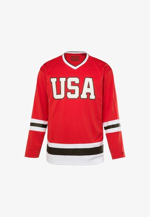 Rotes Eishockey-Trikot mit langen Ärmeln, einem V-Ausschnitt, weißen und schwarzen Streifen an den Ärmeln und am unteren Rand, sowie "USA" in fetten Buchstaben auf der Vorderseite aufgedruckt.