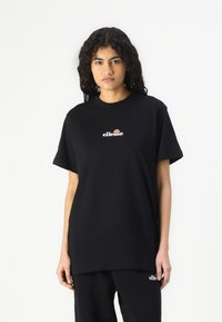 Sort bomulds t-shirt med rund hals og korte �ærmer, med et lille farverigt logo på brystet. Løs pasform, blød tekstur.