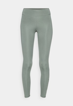 Mint green leggings made from a smooth, stretchy material. Features a high waistband and a fitted design with no visible patterns or accents.