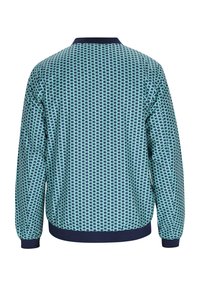 Multikleurige jas met een geometrisch patroon in teal en marineblauw. Zachte textuur, elastische manchetten en een ronde kraag.