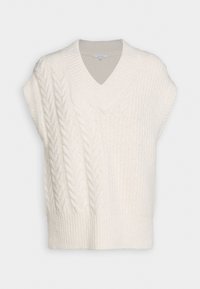 Cremfarbener, ärmelloser Pullover aus Zopfmuster mit V-Ausschnitt, der strukturierte Muster und einen gerippten Saum aufweist. Weicher, gemütlicher Stoff.