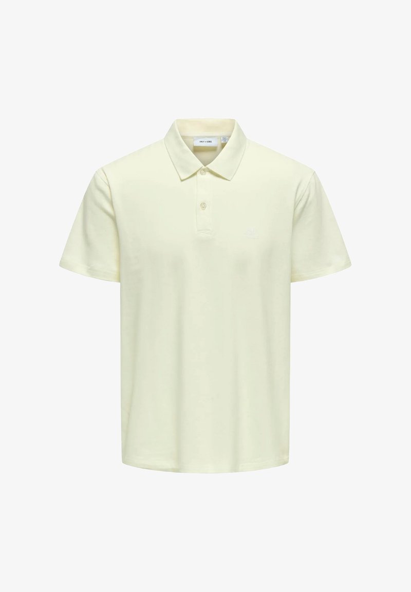 Polo de manga corta amarillo hecho de algodón suave. Presenta un cuello clásico, una tapeta de dos botones y un logo bordado en el pecho.