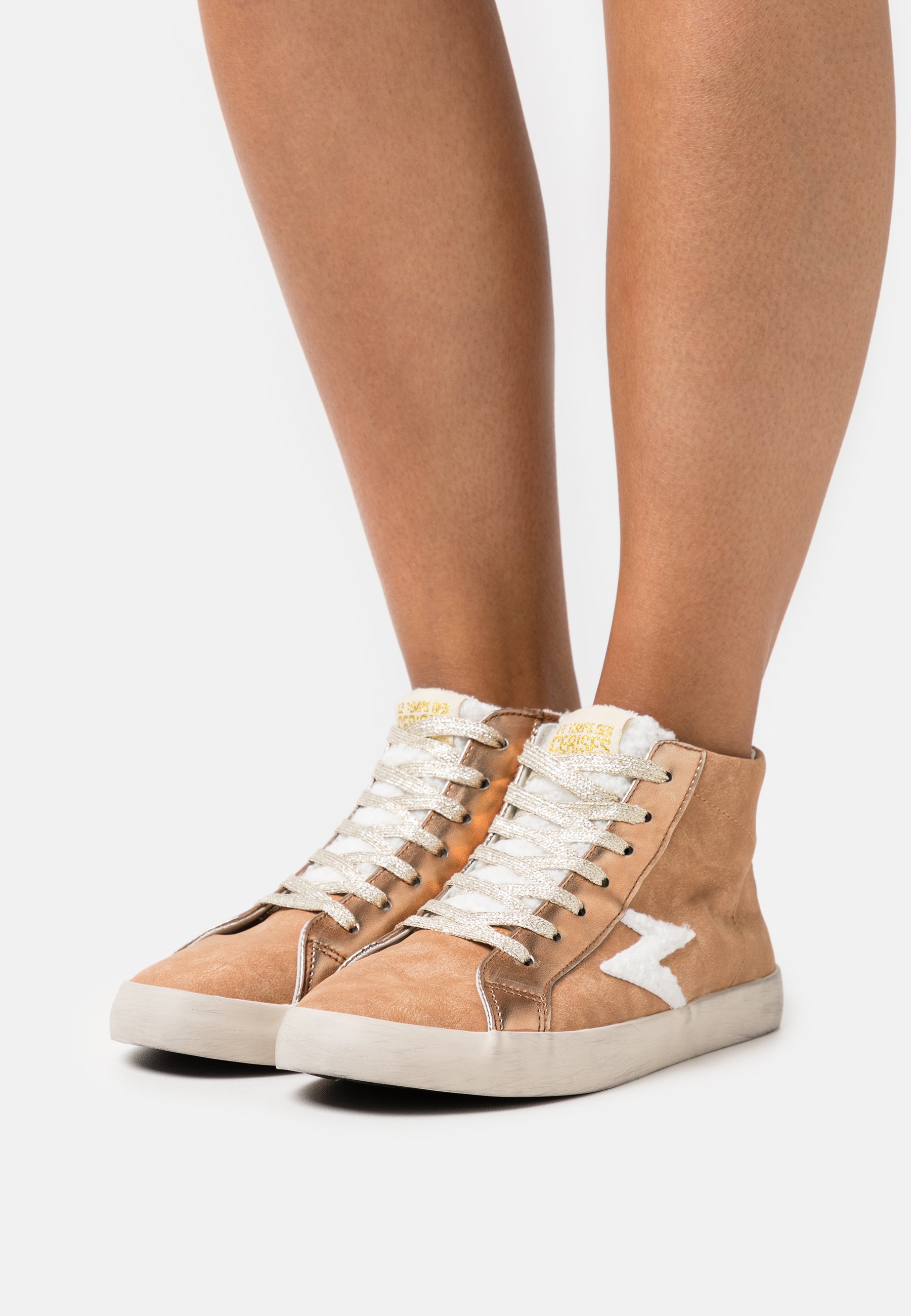 tan high top trainers
