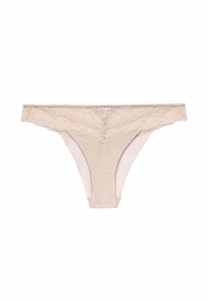 Beige blonde stringtrusse med blomsterprint langs linningen og glat stof foran og bagpå.