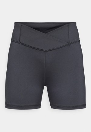 Black high-waisted shorts made of stretchy fabric, featuring a crossover waistband, with flatlock seams and a smooth texture.