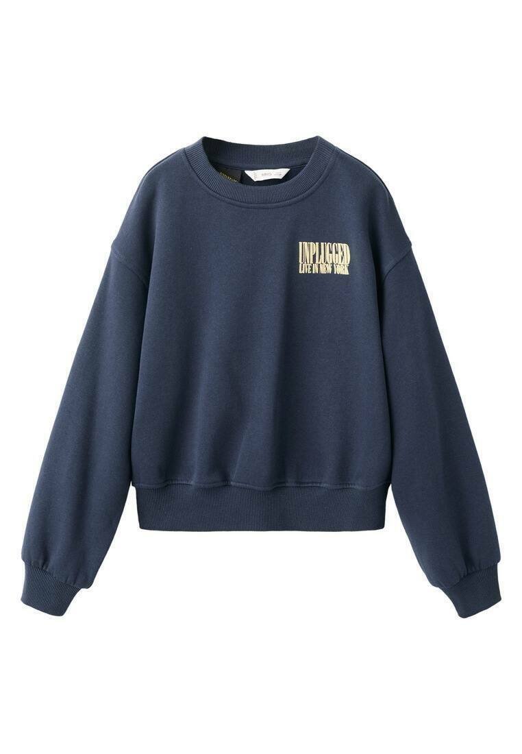 Laivastonsininen collegepaita pyöreällä pääntiellä, resorit hihansuissa ja helmassa. Edessä kultainen painettu teksti "UNPLUGGED LIVE IN NEW YORK".